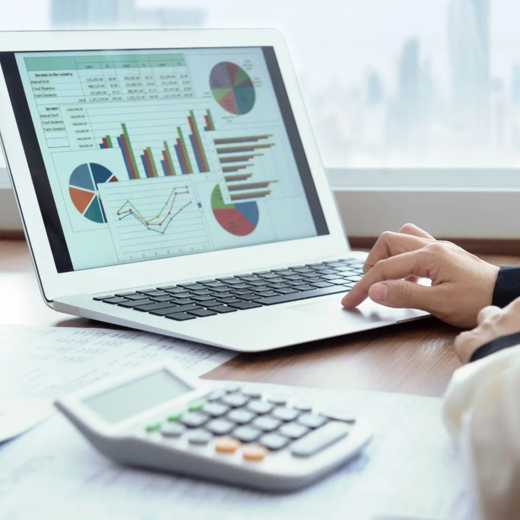 Spreadsheet with marketing analytic graphs on the computer